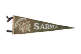 Vintage Sarnia Canada felt pennant in olive green with white lettering and maple leaf graphic.