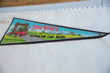 Angled view of the vintage Yogi Bear felt pennant, showing the full colorful graphic and black border.