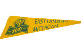 Close-up of the green centennial graphic on the yellow felt pennant.