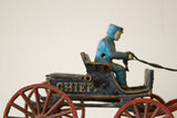 Vintage cast iron Chief buggy, blue driver, 'CHIEF' lettering, red spoked wheels.