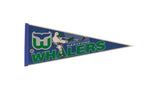Vintage Hartford Whalers blue felt pennant with iconic green and white logo and hockey player graphic.