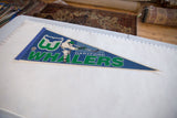 Vintage Hartford Whalers felt pennant laid flat, showing overall condition and shape.