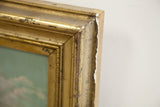 Vintage gold frame corner with chipped finish showing exposed wood.