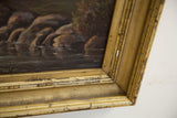 Distressed gold frame corner on a dark Victorian landscape oil painting.