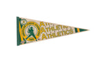 Vintage Oakland Athletics AL Champions 1989 felt pennant, green and yellow with a baseball player graphic.