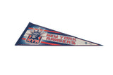 Close-up of vintage New York Rangers felt pennant, featuring blue and red NYR logo.