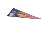 Detailed view of 1999 World Series Champions text on blue and orange felt pennant.