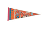 Vintage 1990s Nebraska Husker Big Red felt pennant with mascot and university seal.