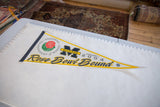 Full length angled view of the 2004 Michigan Rose Bowl felt pennant.