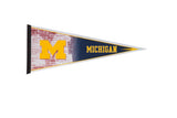Vintage Michigan University felt pennant with a yellow 'M' on a brick graphic and navy blue text.