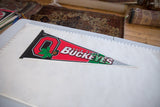 Vintage Ohio State Buckeyes felt pennant laid flat next to a ruler showing its length.