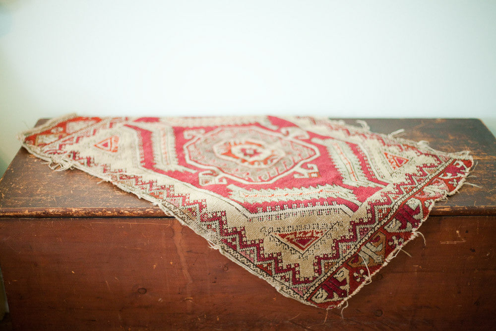 Tattered antique Turkish tribal rug, red, ivory, mint geometric medallion, 1'10" x 2'10".