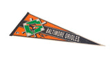 Angled view of a vintage Baltimore Orioles felt pennant in orange, black, and green.