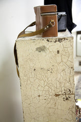 Close-up of the industrial cabinet's corner showing the heavily crackled paint texture.