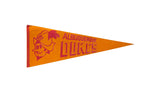 Circa 1980s Albuquerque Dukes felt pennant, orange with red cartoon mascot and bold text, 12x29 inches.