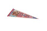 Blue 'WORLD CHAMPS' and Detroit Pistons player caricatures on vintage felt pennant.