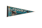 Vintage San Jose Sharks felt flag pennant featuring the team mascot and logo in teal and black.
