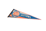An angled profile of the blue and orange vintage Pistons felt pennant.