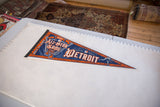 Angled view of the blue and orange 2005 All Star Game Detroit felt pennant.