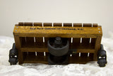Side detail of Old New House stamped reclaimed mahogany mini cart with black wheel.