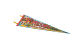Vintage Fort Wilkins Michigan felt pennant corner, showing red trim, yellow ties, and illustrative design.