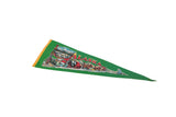Angled close-up of the Alaska pennant's vintage graphic with a totem pole and dogsled.