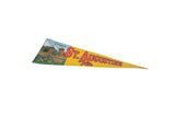 Yellow felt Saint Augustine Florida pennant with City Gates art and visible vintage wear, 8x25 inches.