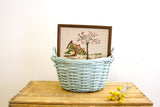 Vintage framed needlepoint art, spring cottage scene with pink blossoms.
