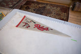 Vintage UNLV Rebels felt pennant laid flat, displaying mascot and logo on a white measuring surface.