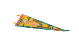 Vintage Ortega's Indian Ruins pennant at an angle, showing its yellow felt and colorful graphics.