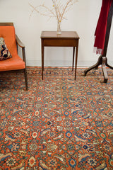 Intricate burnt orange and blue Herati pattern on vintage Persian Hamadan rug.