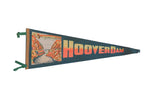 Vintage Hoover Dam felt pennant with a colorful 1960s graphic and orange text on dark felt.