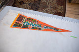 Vintage Meramec Caverns pennant measured against a ruler showing its 27-inch length.