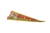 Detail of vintage yellow felt pennant showing a deer, sand dunes, and orange trim.