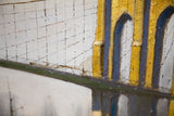 Close-up of the Brooklyn Bridge painting highlighting its textured surface and a small brown age spot.