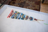 Vintage Niagara Falls Canada pennant measured flat, showing its full length and tapered shape.