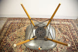 Eames PAW chair underside: birch wood swivel base, metal patina, elephant grey fiberglass.