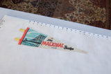 Mackinac Bridge Michigan felt pennant with blue bridge, red text, and light creasing.