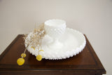 Textured white hobnail milk glass goblet with wavy rim, part of the matching bowl.
