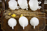 Overhead view of milk glass punch cups showcasing their scalloped rims and swirl pattern.