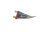 Profile view of the vintage Mark Twain felt pennant highlighting its aged, curled shape.