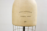 Vintage Wolf Dress Form 38 displaying COLLAPSIBLE MODEL 1969 text on aged linen.