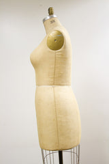 Side profile of the Wolf Dress Form 38 with faded linen texture, wire base.