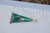 Vintage Philadelphia Eagles green and white felt pennant, showing tip staining and edge pinholes.