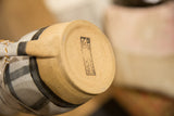 Bracken Fern studio stamp on the unglazed bottom of the ceramic pitcher.
