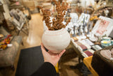 Handmade round ceramic vase with a glossy ivory and blush swirled glaze.