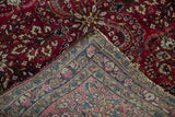 The hand-knotted foundation and weave of an antique German Sarouk rug seen on the reverse corner.
