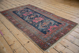 Antique Hamadan runner featuring raspberry sickle leaves and sky blue vine border.