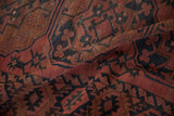 Antique Ersari carpet close-up, dusty raspberry red and navy geometric pattern, showing even pile wear.