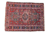 Vintage Karaja rug: triple medallion, hook and latch design, geometric blossoms, cherry red, navy.
